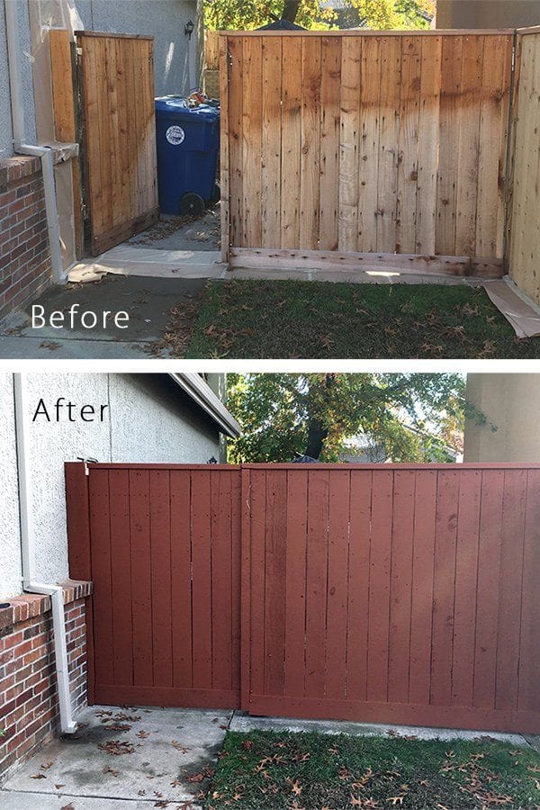Before and after of a residential wood fence and gate. The before shows bare, weathered cedar boards with grey patches; the after shows the same fence in a solid brick-red finish against the stucco wall and brick pillar.