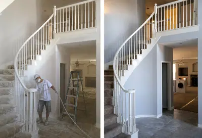 Before and after of a curved interior staircase in Granite Bay. On the left, one of our painters in a respirator sprays the balusters with the treads and floor sheeted; on the right, the finished white handrail, balusters and trim against pale grey walls.